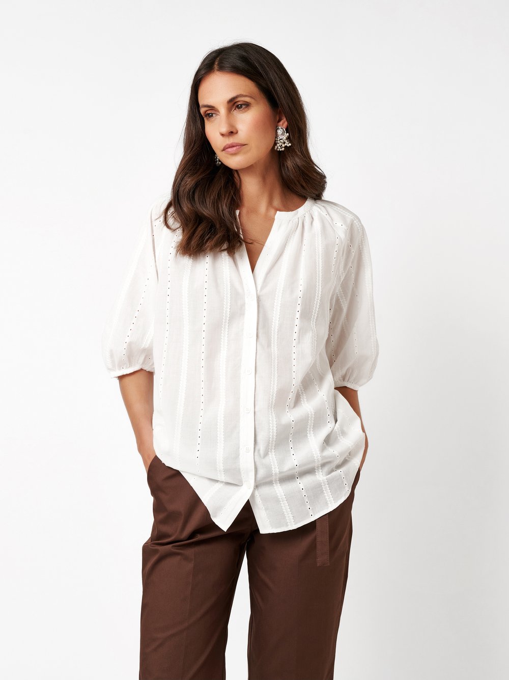 Womens blouse Conni in offwhite, cotton blouse with delicate broderie anglaise, front view worn by model
