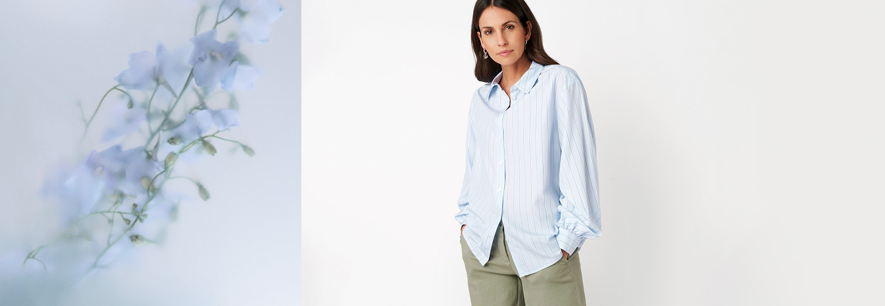 Model wearing a light blue blouse and relaxed trousers with soft floral backdrop – teaser for the “Effortless Elegance” category by TONI