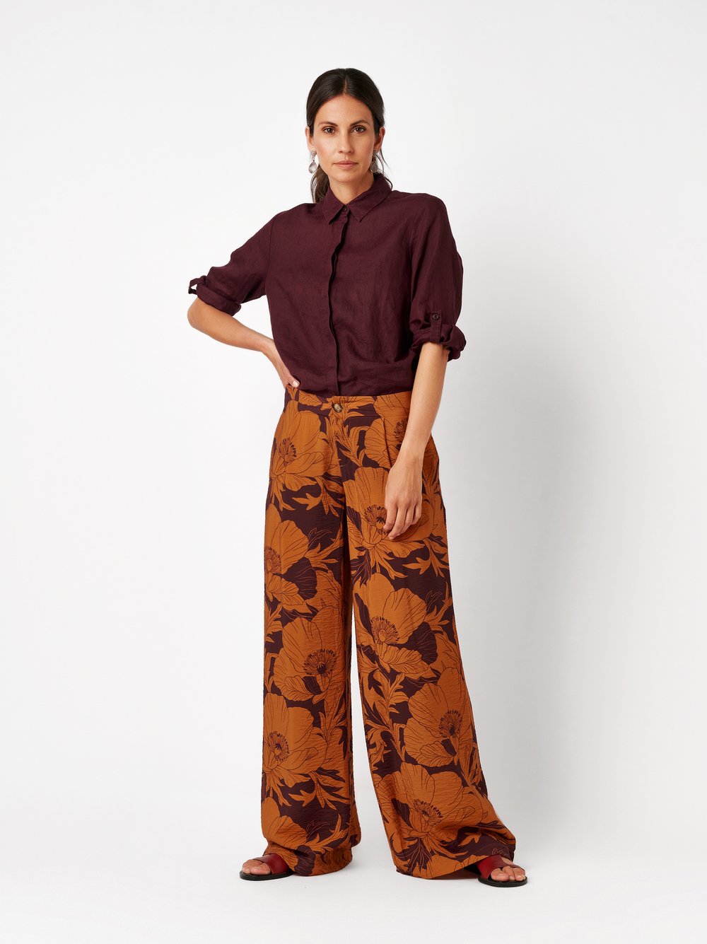 Womens trousers Elli Wide in orange, wide-leg pants with floral print and crepe texture, outfit view worn by model