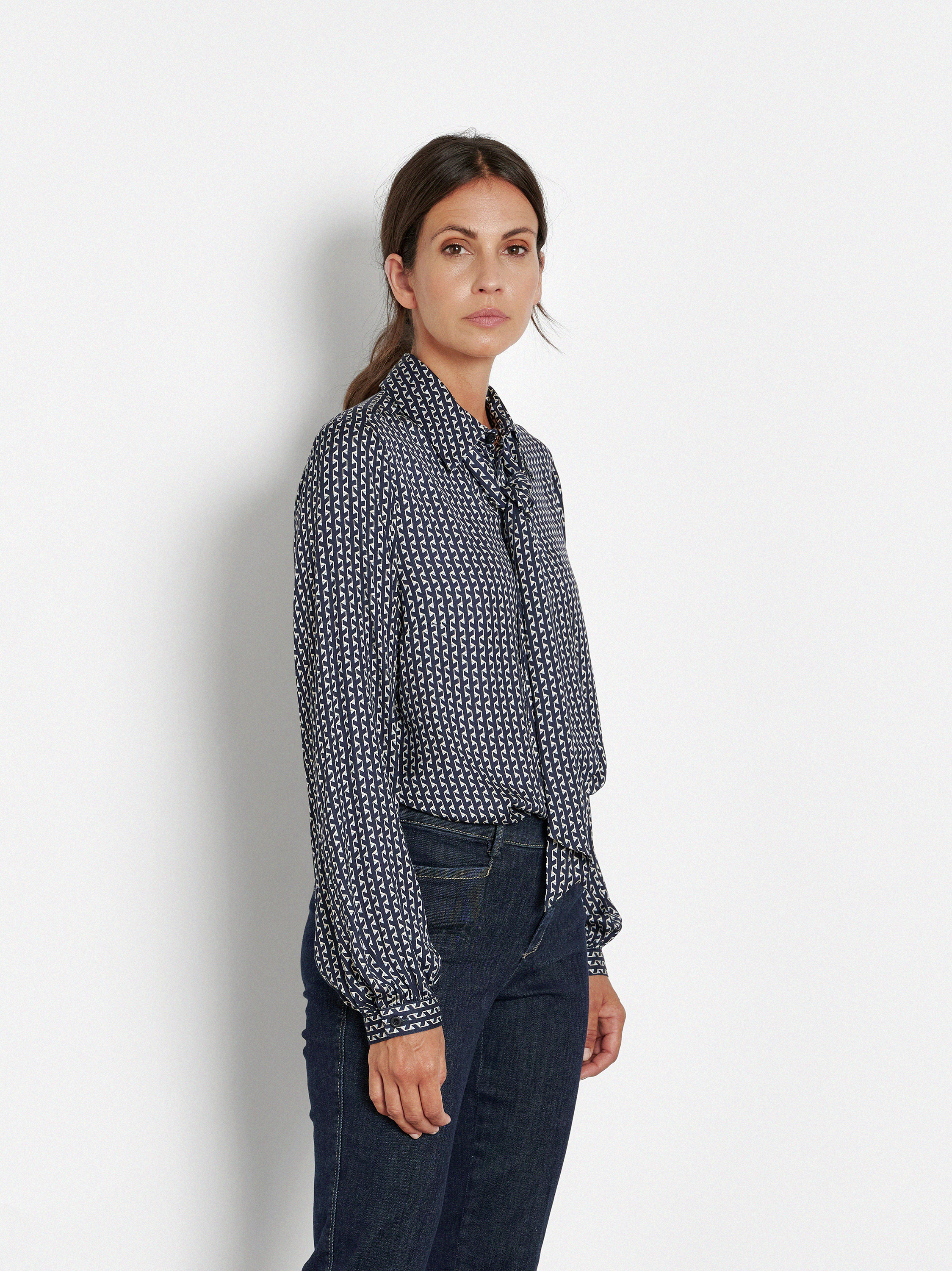 Womens blouse Coco in Navy, bow blouse with graphic print, front view worn by model