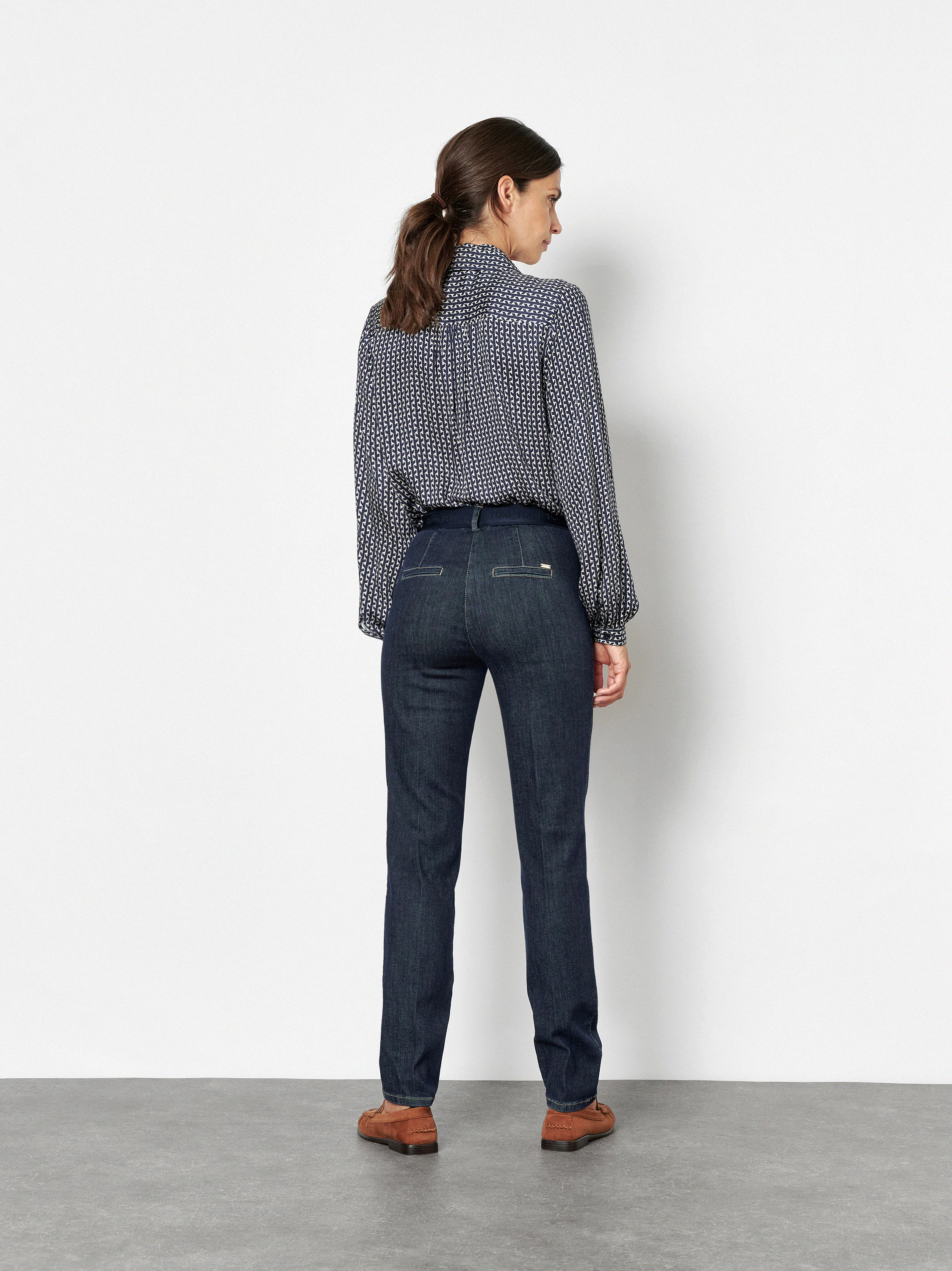 Womens blouse Coco in Navy, bow blouse with graphic print, back view worn by model