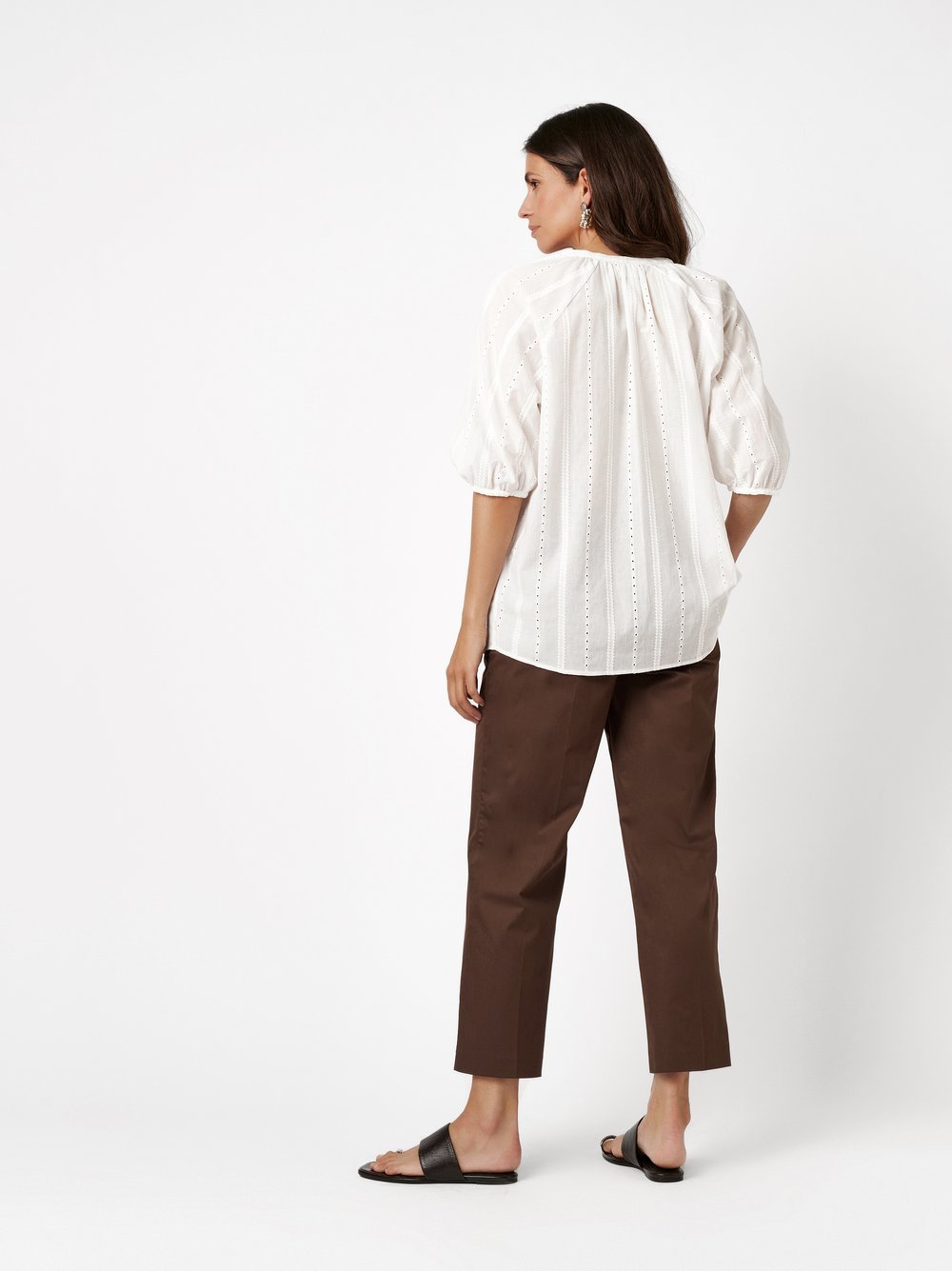 Womens blouse Conni in offwhite, cotton blouse with delicate broderie anglaise, back view worn by model
