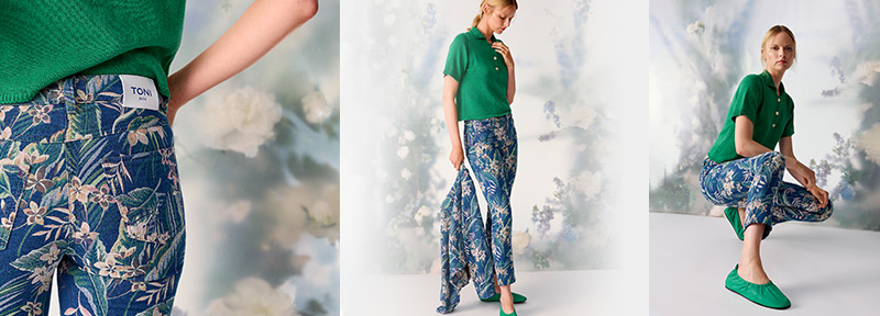Model wearing tropical print trousers with a green top – summery look from TONI’s Modern Tropics category