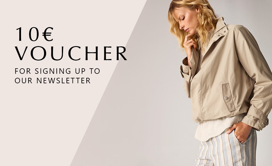 Model wearing a light jacket with striped trousers – newsletter signup teaser with 10 € voucher from TONI