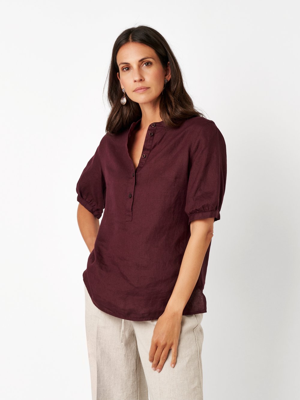 Womens blouse Alis in berry, linen blouse with a band collar, front view worn by model