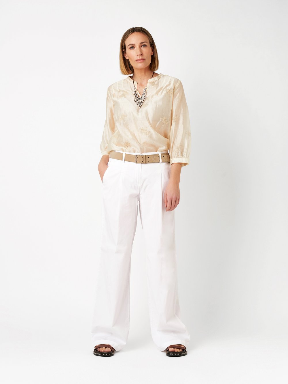 Womens blouse Bella in beige, tunic with a floral embroidery, outfit view worn by model