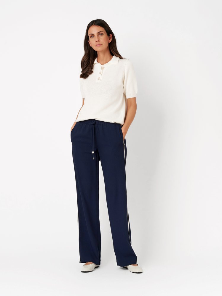Womens trousers Sue Wide in dark blue, wide-leg jogpants with side stripes, front view worn by model
