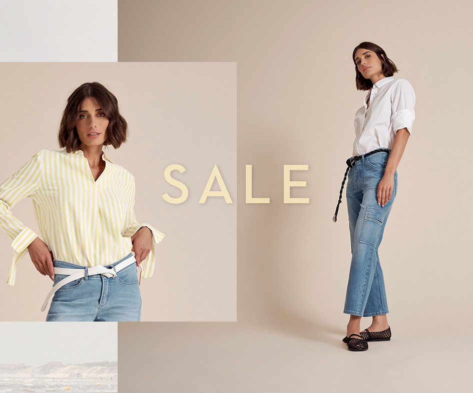 Woman in a TONI outfit gazes into the distance – elegant look for the Summer Sale.