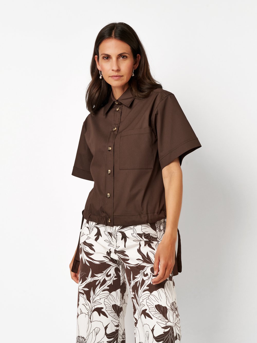 Womens blouse Clay in dark brown, boxy-cut blouse with side lacing, front view worn by model