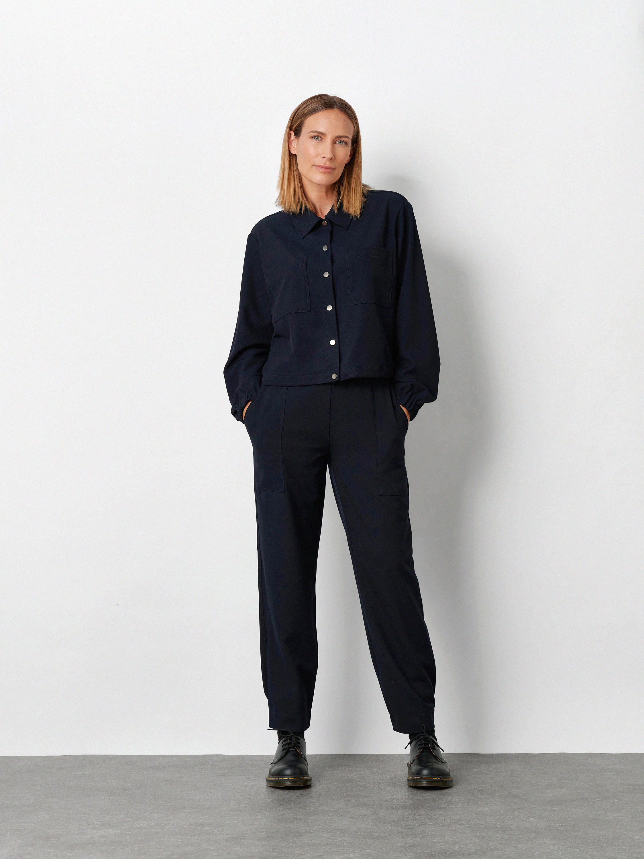 Womens trousers Sue Jogpants in Navy, modern gabardine jogpants, front view worn by model