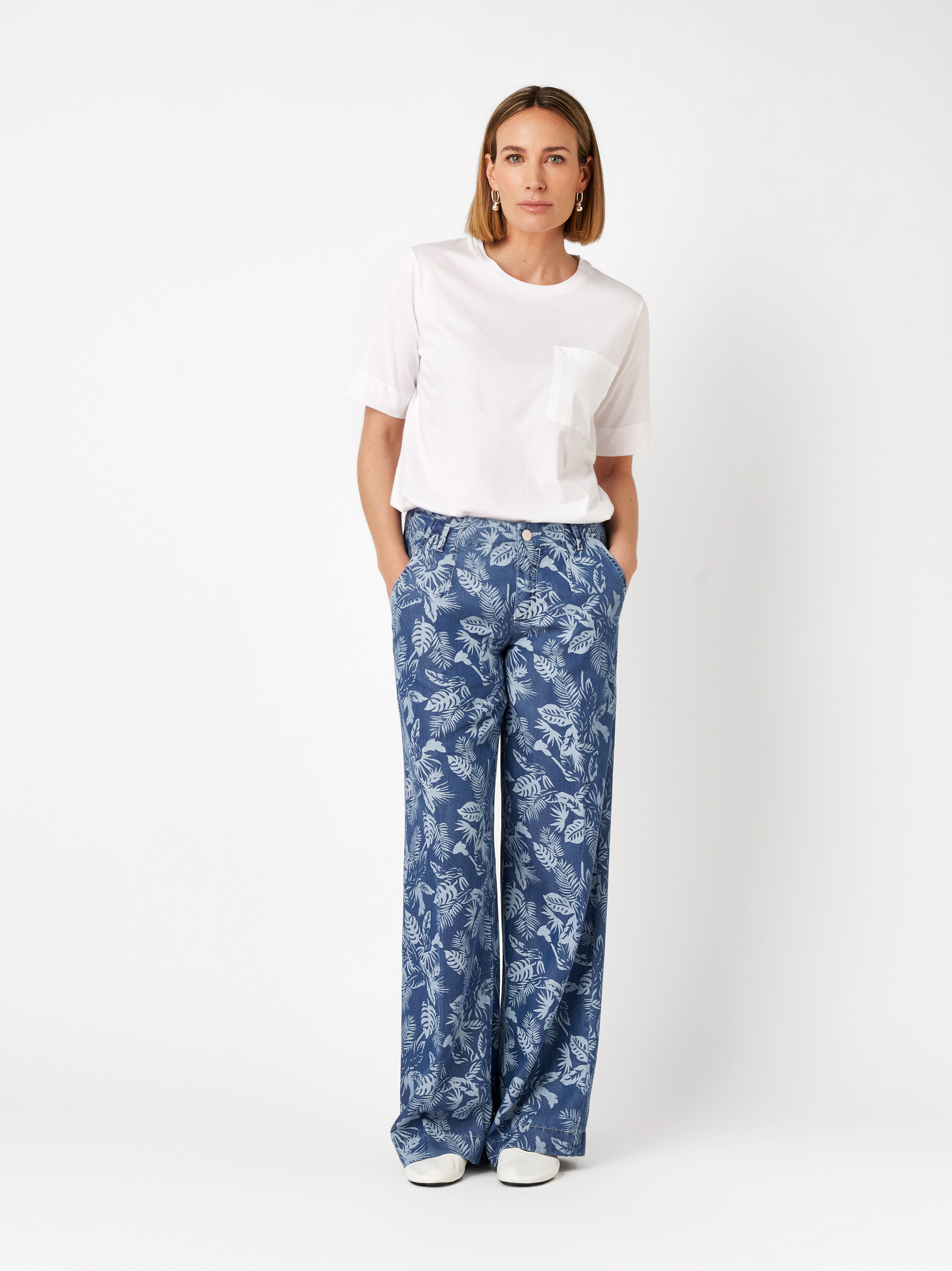 Womens shirt Dolly in white, summer tee with chest pocket, outfit view worn by model