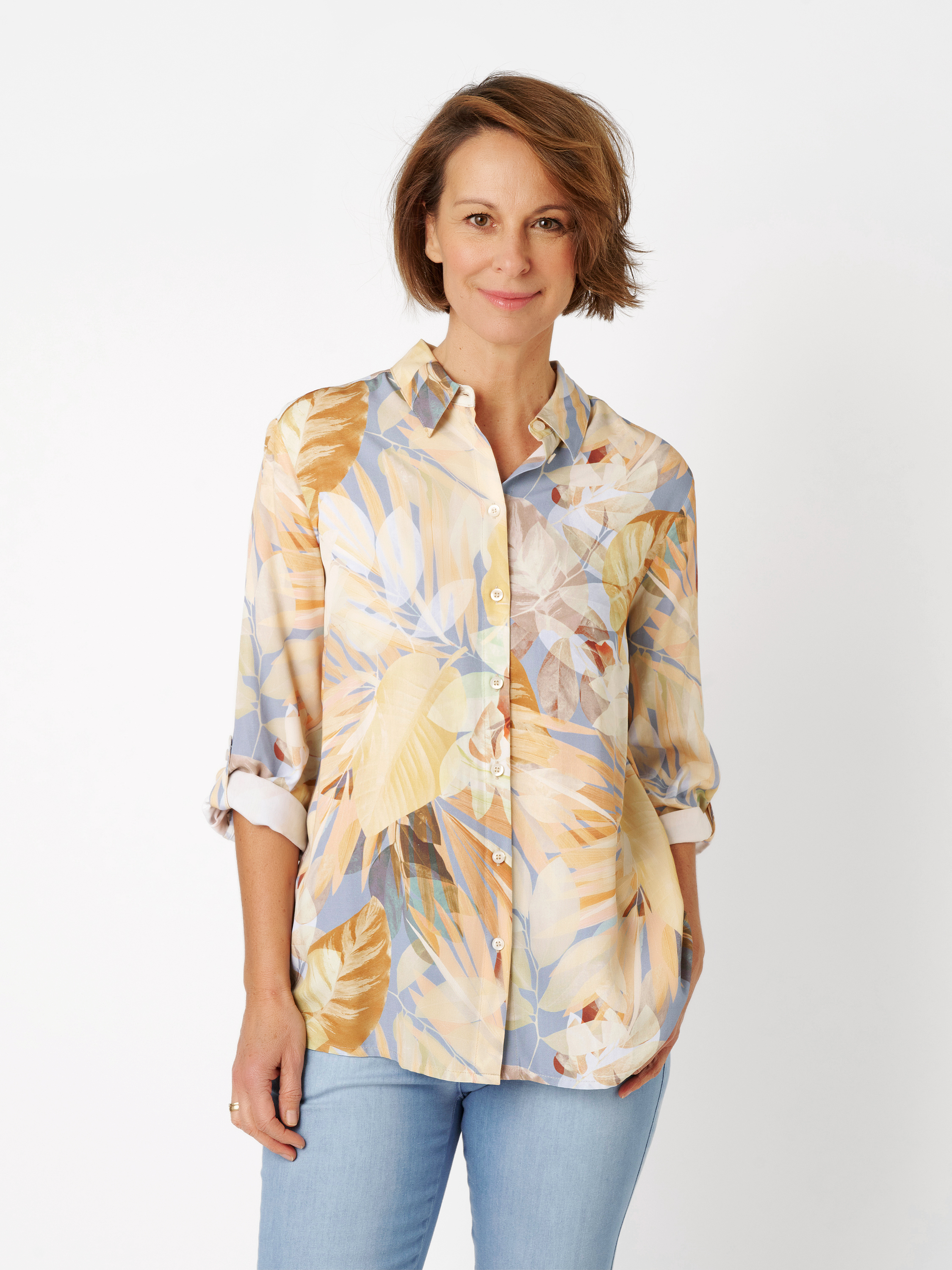 Womens blouse Sweet Bea in multicolour yellow, silky blouse with tropic print, front view worn by model